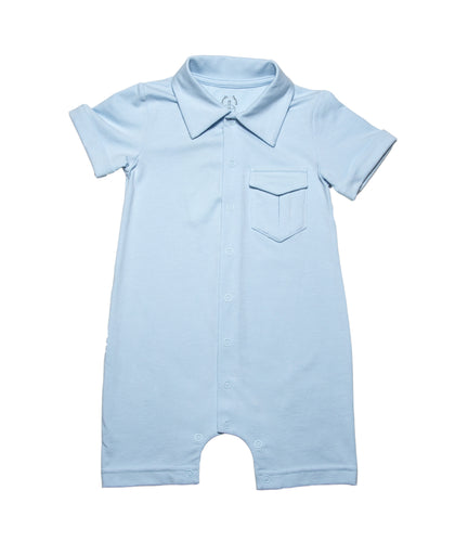 Navy light blue  solid short legs  onesie with  collar and a smart pocket on the chest, short sleeves with roll up detail and full snap button closure. Really smart clean and classic looking in soft organic cotton.
