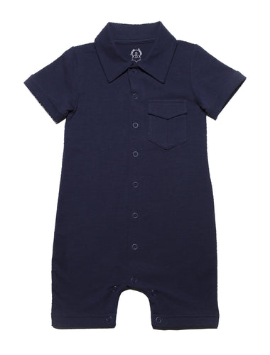 Navy blue dark  solid short leggs  onesie with  white collar and a smart pocket on the chest, short sleeves with roll up detail and full snap button closure. Really smart clean and classic looking in soft organic cotton.