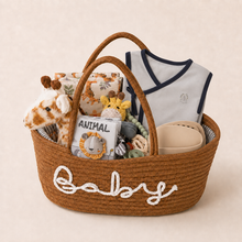 Hand-arranged grey new baby gift basket with safari-themed essentials and reusable nursery basket.