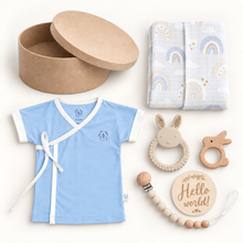 Welcome to the World baby boy gift box with organic Samurai Tee, rainbow muslin swaddle, beige teethers and round kraft box.