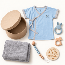 Welcome to the World baby boy gift box with blue organic cotton Samurai Tee, grey muslin swaddle and bunny teethers