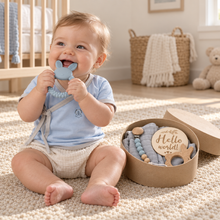 Baby wearing a pale blue Samurai Tee beside the Welcome to the World baby boy gift box